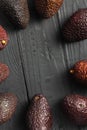 Frame fresh avocado hass wooden dark background top view Royalty Free Stock Photo