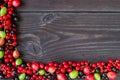 Frame of fresh berries on wooden background