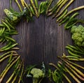 Frame with Fresh Green food, Green vegetables on wooden board. Composition on a dark wooden background of green organic vegetarian Royalty Free Stock Photo