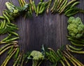 Frame with Fresh Green food, Green vegetables on wooden board. Composition on a dark wooden background of green organic vegetarian Royalty Free Stock Photo