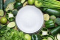 Frame Fresh green vegetables and herbs Empty plate on a wooden background. Copy space Royalty Free Stock Photo