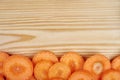 Frame of fresh vegetables around cutting board on wooden background. Healthy natural food on table with copy space on Royalty Free Stock Photo