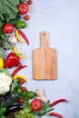 Frame of fresh organic vegetables on a gray concrete background . Healthy natural food top view, copy space . Royalty Free Stock Photo