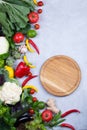 Frame of fresh organic vegetables on a gray concrete background . Healthy natural food top view, copy space . Royalty Free Stock Photo