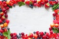 Frame with fresh summer berries mix, strawberries, raspberries, cherries, blueberries and currants Royalty Free Stock Photo