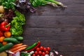 Frame of fresh vegetables on wooden background with copy space