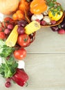 Frame of fresh vegetables on a wooden background Royalty Free Stock Photo