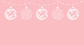 Frame of garland and Christmas balls with a snowflakes and fir branches pattern on a pink background, copy space Royalty Free Stock Photo
