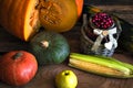 The frame of the gifts of autumn pumpkins, corn, fall leaves, tomatoes, red berry cranberry and grape. Royalty Free Stock Photo