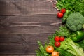 Frame of green and red fresh vegetables on wooden background, top view, copy space Royalty Free Stock Photo