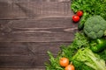 Frame of green and red fresh vegetables on wooden background, top view, copy space Royalty Free Stock Photo