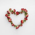 Frame In A Heart Shape Made With Dried Red Roses On White Background. Valentines Day.