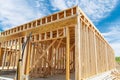 A frame of a house against a blue sky the beginning of the construction of the house construction site