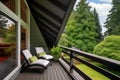 a-frame house loft balcony, overlooking lush green lawn Royalty Free Stock Photo