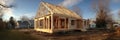 Frame House Under Construction With Insulation Installed and Clear Upper Zone Visible During Late Afternoon Royalty Free Stock Photo