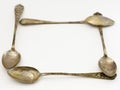 Frame made of antique tattered silver spoons Royalty Free Stock Photo
