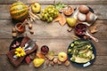 Frame made of autumn vegetables, fruits and cutlery on wooden background, flat lay. Happy Thanksgiving day Royalty Free Stock Photo