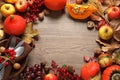 Frame made of autumn vegetables, fruits and cutlery on wooden background, space for text. Happy Thanksgiving day Royalty Free Stock Photo