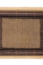 Frame made of burlap lying on a bamboo mat in the form of manuscript Royalty Free Stock Photo