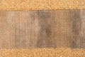 Frame made of burlap and rice grains, with space for your creativity, text. Rice on sacking Royalty Free Stock Photo