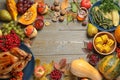 Frame made of delicious turkey, autumn vegetables and fruits on background, flat lay with space for text. Happy