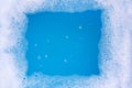 Frame made of detergent foam bubble. Blue background Royalty Free Stock Photo