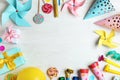 Frame made of different birthday party items on white wooden table, flat lay. Space for Royalty Free Stock Photo