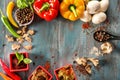 Frame made of different spices and vegetables on wooden background Royalty Free Stock Photo