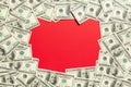 Frame made of dollars with copy space in the middle. Top view of business concept on red background with copy space Royalty Free Stock Photo