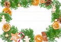 Frame made with fir tree branches, oranges, gingerbread cookies Royalty Free Stock Photo