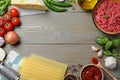 Frame made of fresh lasagna ingredients on wooden table, flat lay. Space for text Royalty Free Stock Photo