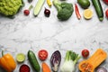 Frame made of fresh ripe vegetables and fruits on marble background, flat lay. Royalty Free Stock Photo