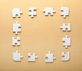 Frame made of jigsaw puzzle pieces on color background Royalty Free Stock Photo