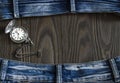 Frame made of old worn jeans and a pocket watch Royalty Free Stock Photo