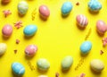 Frame made of painted Easter eggs on color background Royalty Free Stock Photo