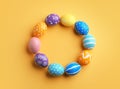 Frame made of painted Easter eggs on color background, top view Royalty Free Stock Photo
