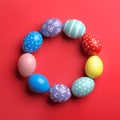 Frame made of painted Easter eggs on color background. Space for text Royalty Free Stock Photo