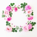 Frame made of pink flowers - roses and peonies with leaves on white background. Floral composition. Flat lay, top view. Royalty Free Stock Photo