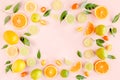 Frame made of summer tropical fruits: orange, lemon, lime, mango on pink background. Food concept. flat lay, top view Royalty Free Stock Photo