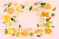 Frame made of summer tropical fruits: orange, lemon, lime, mango on pink background. Food concept. flat lay, top view Royalty Free Stock Photo