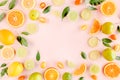 Frame made of summer tropical fruits: orange, lemon, lime, mango on pink background. Food concept. flat lay, top view Royalty Free Stock Photo