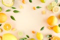 Frame made of summer tropical fruits: orange, lemon, lime, mango on yellow background. Food concept. flat lay, top view Royalty Free Stock Photo