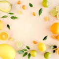 Frame made of summer tropical fruits: orange, lemon, lime, mango on yellow background. Food concept. flat lay, top view Royalty Free Stock Photo