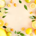 Frame made of summer tropical fruits: orange, lemon, lime, mango on yellow background. Food concept. flat lay, top view Royalty Free Stock Photo