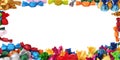Frame made of tasty candies in colorful wrappers on white background. Banner design Royalty Free Stock Photo