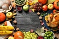 Frame made of turkey, autumn vegetables and fruits on dark background, flat lay. Happy Thanksgiving day Royalty Free Stock Photo