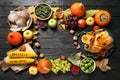 Frame made of turkey, autumn vegetables and fruits on wooden background, flat lay. Happy Thanksgiving day Royalty Free Stock Photo