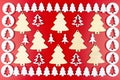 A frame made of white, wooden Christmas trees isolated on a red background, inside a large, wooden Christmas tree. Royalty Free Stock Photo