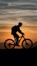 Frame Man on mountain bike, silhouette against sunset backdrop Royalty Free Stock Photo