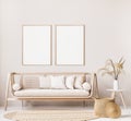 Frame mock up in farmhouse style living room with wooden trendy sofa and white vase with dried flowers